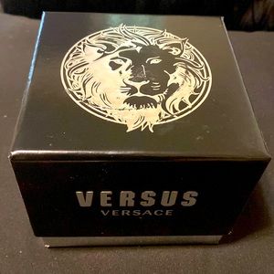 Versus Versace watch with green background gold and silver